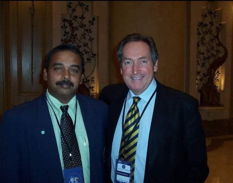 With Gerard Houllier